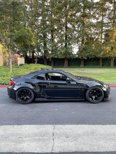 a black sports car parked on the street