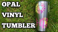 the words opal vinyl tumbler are in front of an image of flowers