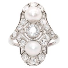 An Art Deco diamond, pearl, and white gold ring, comprising one large old European cut diamond, sixteen smaller old European cut diamonds, and six rose cut diamonds, set in 18 karat white gold, to a band of 18 karat white gold. This stunning Art Deco ring is set to the centre with a gorgeous old European cut diamond. The old European cut diamond, which is wonderfully sparkly, bright, white, and has good colour and clarity, is held within a millegrain edged bezel setting. The principal diamond ap Luxury Rose Cut Diamond Pearl Ring For Anniversary, Art Deco Geometric, Coron, Deco Ring, European Cut Diamonds, Art Deco Diamond, Ring Fit, Gorgeous Art, Diamond Shaped