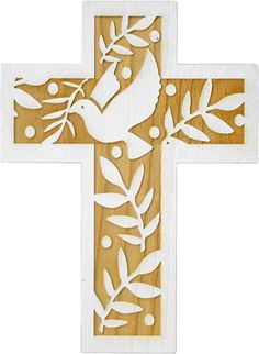 a wooden cross with a dove and leaves on it