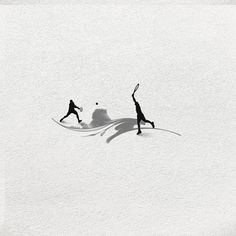 two people playing tennis in the snow with their shadows on the ground and one person reaching up to hit the ball