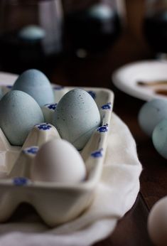 several eggs in a tray on a table