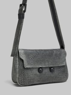 Trunkaroo Soft shoulder bag made of crocodile print leather with a hand-buffed vintage effect. Medium size. The rectangular shape features a front flap closed via a large magnetic clasp engraved with the Marni logo and two half spheres covered in tonal leather. Nappa lining with single pocket. Adjustable leather strap with tonal buckle. Flat Heel Boots, Vintage Effect, Necklace Dress, Crocodile Print, Lacing Sneakers, Boot Accessories, Denim Bag, Bag Dress, Cool Socks