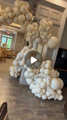 balloons are hanging from the ceiling in a room