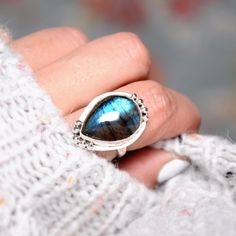 Silver ring with amazing teardrop shape Labradorite gemstone. Amazing iridescent effect with beautiful blue and green colors. Made of solid sterling silver. ❥ Metal: Solid sterling silver ❥ US Ring Size: Choose Size ❥ Width: 25mm ❥ Gemstone: Labradorite ❥ Gemstone Color: Multi-color ✈ Free Shipping (USPS) 🎁 Free Gift Box ↻ 60 Days Return ⌛ 24 Handling Time ** GET 15% OFF COUPON ** Visit 👉 boho-magic.com/join Join and get coupons, exclusive offers, updates, and more surprises! ** ALSO IN OUR SH Nature-inspired Teardrop Gemstone Jewelry, Teardrop Opal Ring For Gift, Handmade Teardrop Crystal Ring Gift, Bohemian Teardrop Moonstone Ring Gift, Bohemian Teardrop Gemstone Ring, Spiritual Teardrop Gemstone Rings, Adjustable Teardrop Crystal Ring With Gemstone, Handmade Teardrop Opal Ring Gift, Unique Teardrop Promise Ring