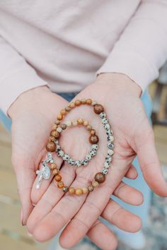 This beautiful gemstone rosary bracelet features wooden round beads as the paters in size medium and oval wooden bead in the size large (to add length) with Picture Jasper and Dalmation Jasper beads as the aves. Each of our stretch and wrap rosary bracelets is a full rosary. 

Each bracelet also includes a “bookmark”crucifix medal. This medal is moveable and can help you keep track of where you are at in your rosary as you pray throughout your day.

Each bracelet is strung on durable elastic making it easy to stretch and wrap around your wrist without fear of snapping it. Wooden Beads Rosary Bracelet For Meditation, Meditation Rosary Bracelet With Wooden Beads, Spiritual Rosary Bracelet With Wooden Beads, Adjustable Wooden Beads Rosary Bracelet For Meditation, Custom Jewelry Necklaces, Dalmation Jasper, Custom Rosary, Rosary Bracelet, Gifts Under 10