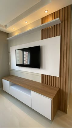 a large flat screen tv mounted to the side of a wall