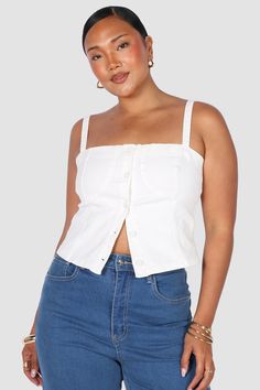 Denim on denim is making a comeback with our Siren Denim Top white out! A new take on our previous design, with matching stitching to compliment this wear-on-repeat item. A top made to be seen - wear this one with any of your denim pieces in your wardrobe for the ultimate cool girl vibe! With a flattering straight neckline and adjustable shoulder straps, this structured top will be a timeless piece in your wardrobe. Why you'll love this: Take her from the office to drinks with no fuss, she is th Trendy Cotton Denim Top For Day Out, White Casual Denim Top For Summer, Trendy Cropped Cotton Denim Top, Spring Cropped Cotton Denim Top, White Denim Casual Tops, White Trendy Denim Top For Spring, Trendy White Denim Top For Spring, White Cotton Denim Top For Summer, Casual White Cotton Denim Top