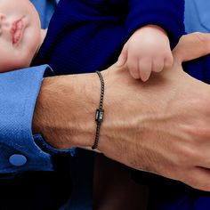 Get your man something personal and stylish for a special occasion. Introducing our exquisite Custom Silver Bracelet with Kids' Names, a heartfelt gift that Dad will cherish forever. Handcrafted with love, this bracelet serves as a beautiful reminder of the special bond between father and children. Each side is meticulously engraved with the names of your little ones, creating a personalized piece that captures their unique personalities. The sleek, versatile design ensures that Dad can wear thi Dad With Kids, Family Bracelet, Family Bracelets, Father Gift, Kids Names, Dad Day, Black Chain, Heartfelt Gifts, Gift For Dad