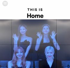 two women sitting on a couch in front of a screen with the words this is home