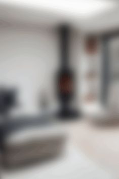 blurry photograph of kitchen appliances and counter tops in an empty room with white walls