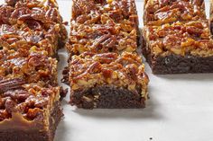 several pieces of brownie with pecans on top