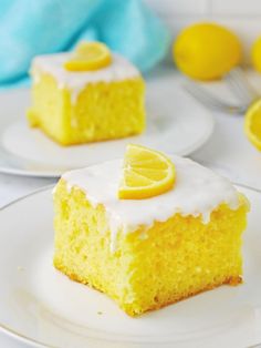 two slices of lemon cake on white plates