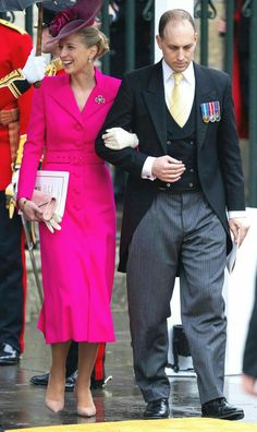 the duke and princess of cambridge are walking in the rain