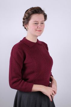 This feminine, everyday 1940s-style pullover is 100% pure soft Merino wool with a delicate cable knit pattern. The short pullover goes below the waist with a wide rib edge at the bottom. The sleeves are three-quarters long and end with a wide rib edge. The collar is typical of the 40s, with a small opening in the neck that closes with a snap fastener. The yarn is super soft and made in Italy. Available in sizes XS, S, M, L, XLSee the stated dimensions in the size chart.Material: 100% Merino wool 1930s Shoes, Short Pullover, 1950s Shoes, 1920s Shoes, 1940s Shoes, Cable Knit Pattern, The 40s, 1940s Style, Winter Fashion Boots