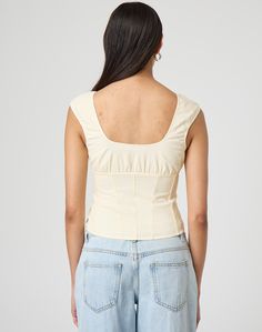 This delicate little number features cap sleeves, a ruched bodice and panelling. Sleeveless Top With Gathered Neckline For Spring, Fitted Tops With Ruched Bodice For Spring, Fitted Ruched Top With Square Neck, Chic Fitted Top With Ruched Bodice, Fitted Summer Top With Ruched Bodice, Summer Tops With Ruched Bodice, Summer Fitted Tops With Ruched Bodice, Fitted Tops With Ruched Bodice For Summer, Spring Square Neck Ruched Top