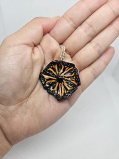 I made this piece out of polymer clay and sterling coated silver chain. A pendant necklace based on monarch butterfly colors and sun shape.  Chain lenght is 18 inches( lays close to collar bone) The pendant is 3cm height and lenght and 3mm in depth and lightweight.this is a small light weight and dainty necklace. Black Hand Painted Pendant Jewelry, Hand Painted Black Pendant Jewelry, Hand Painted Black Polymer Clay Jewelry, Black Polymer Clay Jewelry Gift, Orange Polymer Clay Jewelry As A Gift, Handmade Orange Necklace With Flower Pendant, Handmade Orange Flower Pendant Necklace, Hand Painted Orange Jewelry For Gifts, Hand Painted Orange Necklace For Gifts