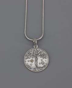 Embrace the profound symbolism of nature and the cosmos with the sterling silver necklace, featuring a round pendant exquisitely embossed with a celestial tree of life symbol. This symbolic pendant represents the connection between heaven and earth, with its roots and branches intertwined in a timeless dance. Adding to its celestial theme, the pendant is thoughtfully studded with a small citrine representing the sun's vibrant energy and a small moonstone symbolizing the serene beauty of the moon Celestial Theme, Buddha Groove, Tree Of Life Symbol, Heaven And Earth, Life Symbol, Vibrant Energy, The Cosmos, Heaven On Earth, Stand Tall