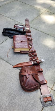 handmade duty belt made from thick leather includes a notepad, magnifier glass, bottle, glove holster, knife with holster, a leather satchel and 2 rings for either rope or to hang herbs Duty Belt, Fair Outfits, 2 Rings, Fantasy Costumes, Leather Projects, Fantasy Clothing, Fantasy Fashion, Character Outfits, Larp