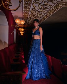 This lehenga set features all over tonal sequin embroidery in a geometric pattern. The ensemble is paired with a strappy blouse and a matching net dupatta.From Seema Gujral’s Night at the Opera collectionDELIVERY TIMEPlease wait 8-12 weeks for your outfit to arrive.FABRIC DETAILSNetProfessional cleaning only. Blue Sequined Sets For Reception, Blue Anarkali Set With Sequins For Reception, Designer Blue Lehenga With Sequins, Designer Blue Sequined Lehenga, Blue Evening Lehenga, Blue Sequined Party Wear Sets, Blue Sequined Pre-draped Saree, Blue Lehenga With Zari Work For Evening, Blue Sequined Anarkali Set For Party