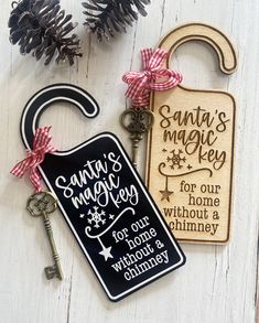 two wooden key tags with the words santa's magic key and for our home without a chimney