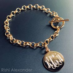 "Rishi Alexander offers Handmade, Up-Scale Jewelry and Gifts. For many of our Unique items, we offer Personalized Monograms that are done by our own in house Engravers. Each Buyer will get a brand new .925 Sterling Silver Toggle Link Charm Bracelet with a Gold Finish! This is absolutely the perfect starter charm bracelet. Why not have your first charm be a monogrammed one! Add more charms to this bracelet or rock it proudly with your own monogram. We do custom monograms for each Jewelry Item so