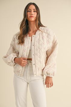 Introducing the Floral Quilted Jacket, perfect for those looking for a romantic and oversized style. Its cropped design is both trendy and practical, while the front snap button details add a touch of elegance. The beautiful floral print adds a feminine touch to any outfit. Stay stylish and comfortable in this must-have jacket.