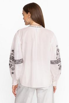 The Irenie Kivi Blouse is crafted from breathable, 100% cotton fabric. Featuring a split V-neckline with gathers at the neck and sleeves, this lightweight blouse is finished with intricate placement embroidery and ruffling at the cuffs. Pair with classic denim and fashion sneakers for a weekend look with impeccable style. Johnny Was Women's Kivi Blouse in White, Size XS, Cotton/Denim Bohemian Blouse With Gathered Sleeves, V-neck, Bohemian Blouse With Gathered Sleeves And V-neck, Bohemian V-neck Blouse With Gathered Sleeves, Cotton Tops With Gathered Sleeves For Daywear, Peasant Cotton Blouse With Bishop Sleeves, Cotton Bishop Sleeve Blouse For Summer, Summer Cotton Blouse With Bishop Sleeves, White Cotton Blouse With Bishop Sleeves, Folk Style Cotton Tops For Spring