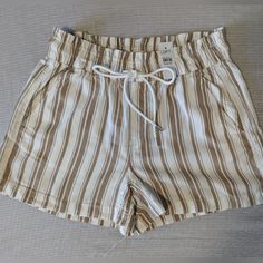 Lightweight And Relaxed, These Loft Paper-Bag Style Waistline Shorts Are The Perfect Item For A Comfortable And Stylish Summer. The Neutral Tone Cream And Tan Stripes Are A Classic Combo. New With Tags And From A Smoke Free Home. Trendy Beige Shorts For Vacation, Trendy Beige Shorts For Beach Season, Beige Summer Bottoms With Paperbag Waist, Beige Paperbag Waist Summer Bottoms, Summer Beige Paperbag Waist Bottoms, Trendy Beige Paperbag Waist Shorts, Casual Brown Shorts For Day Out, Beige Summer Shorts For Outings, Beige Shorts For Summer Outings