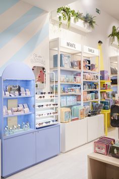 the inside of a store with many items on shelves and in front of it is a display case