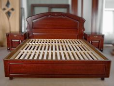 a bed with wooden headboard and foot board