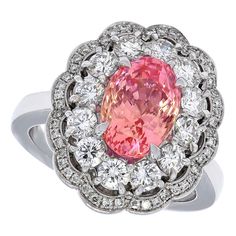 18kt White Gold Diamond Ring 4.06ct Sapphire No Heat Padparadscha SSEF Certified. Unique luxurious ring with natural unheated pink Padparadscha sapphire and diamonds Completely handcrafted Sapphire: pink oval modified brilliant Padparadscha sapphire 4.06 carat in total, light orangy pink, no indications of heating, origin Ceylon. Measurements: 10.18 x 7.27 x 6.4 mm. Diamonds: Brilliant cut diamonds, together 1.38 carat. Material: 18 kt white gold Size: 55 (size adjusted for free) Weight: 13.6 gr Bling Engagement Ring, Padparadscha Sapphire, Rose Orange, Tourmaline Jewelry, Gold Diamond Ring, White Gold Diamond Rings, Diamond Star, No Heat, Vintage Jewels