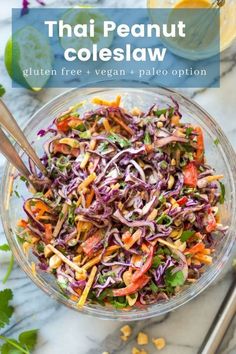 thai coleslaw salad in a glass bowl with chopsticks on the side