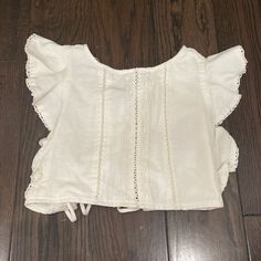 Zara Linen Crop Top Ruffle Sleeves Tie In The Back Size Medium Hasn’t Been Worn Brand New No Tags Zara Crop Top For Beach, Zara Ruffled Tops For The Beach, Zara Ruffled Tops For Vacation, Zara Crop Top For Vacation, Zara Vacation Crop Top, Zara Cotton Summer Crop Top, Zara Summer Tops With Lace Trim, Zara Tops With Lace Trim For Summer, Zara Lace Trim Tops For Summer