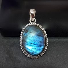 💖  Product Description Stunning Large Boho Oval Blue Labradorite Pendant set in 925 Sterling Silver, with Silver Rope Detailing around the stone..  The pendant pictured is the actual piece you will receive We recommend our 1.5mm Spiga chains for this pendant, which you can select at checkout in various lengths, or just have the pendant on its own.  (Prices with a chain includes the pendant and chain price) If you prefer a different style of chain, we have other chain designs in the Chains Secti Sapphire Jewelry With Oval Stone Setting, Oval Sapphire Jewelry With Stone Setting, Oval Cabochon Labradorite Jewelry, Oval Labradorite Cabochon Jewelry, Oval Labradorite Wedding Jewelry, Oval Silver Labradorite Gemstones, Oval Labradorite Jewelry Stamped 925, Silver Oval Pendant Gemstones For Jewelry Making, Silver Labradorite Oval Jewelry