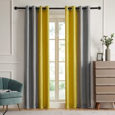 a living room with yellow and grey curtains