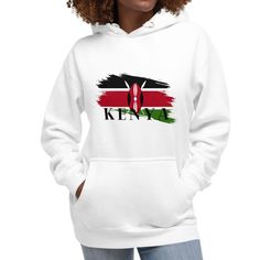 A Kenya flag Hoodie that proudly displays the national emblem. This hoodie is crafted from high quality, organic cotton fabric with the bold and captivating design of the Kenyan flag. The flag featured three horizontal stripes; black, red and green, with a Masaai shield and spears at the center. This t-shirt is not only a symbol of national pride but also a fashion statement that celebrates Kenya's rich heritage and history. Wear it with pride and showcase your connection to this beautiful East African nation. You won't regret buying this classic streetwear piece of apparel with a convenient pouch pocket and warm hood for chilly evenings. * 100% cotton face * 65% ring-spun cotton, 35% polyester * Front pouch pocket * Self-fabric patch on the back * Matching flat drawstrings * 3-panel hood National Emblem, Classic Streetwear, Horizontal Stripes, Fabric Patch, Organic Cotton Fabric, The Flag, Spears