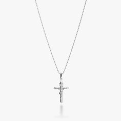 Rhodium plated sterling silver Cross, 30x17mm Lobster clasp Made in Italy CLASSIC CRUCIFIX NECKLACE - Show your faith with this Italian handcrafted 925 sterling silver crucifix pendant necklace featuring Jesus on the cross.The pendant dangles from a solid sterling silver rope chain. Wear as a symbol of your faith or as a personal statement. Perfect for easy everyday wear, this simple crucifix necklace looks great with both casual and formal outfits. Wear alone for timeless elegance or layered wi Sterling Silver Crucifix Cross Necklace With Adjustable Chain, Classic Sterling Silver Crucifix Necklace, Sterling Silver Crucifix Necklace With Silver Chain, White Gold Crucifix Necklace With Silver Chain, White Gold Sterling Silver Crucifix, Sterling Silver Crucifix Necklace With Polished Finish, Sterling Silver Crucifix Cross Necklace In White Gold, White Gold Sterling Silver Crucifix Necklace, Sterling Silver Crucifix With Silver Chain