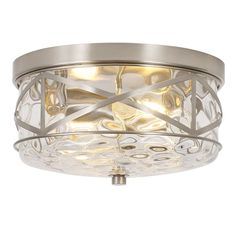 a flush light fixture with an intricate design on the front and side panels, in brushed steel