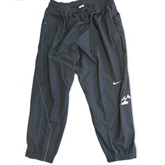 Made With Smooth Taffeta Fabric, These Mesh-Lined Track Pants Pack High-Performing Tech Inside An Evocative Design. Articulated Seams Trace The Lines Of Your Body For Ease Of Movement. Plus, They're Fully-Lined For Comfort And Breathability. A Signature Acronym Graphic And Embroidered Swoosh Celebrate This Iconic Pairing. This Product Is Made With At Least 50% Recycled Polyester Fibers. * Shown: Black/Black * Style: Cu0468-010 * Standard Fit For A Relaxed, Easy Feel Nike Joggers Mens, Trace The Lines, Nike Sweatpants Mens, Blue Pants Men, French Terry Pants, Nike Sportswear Mens, Basketball Pants, Taffeta Fabric, Nike Fleece