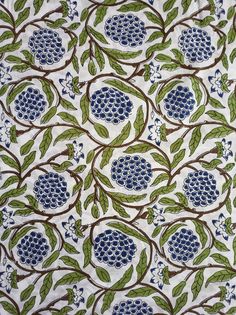 a blue and green pattern with leaves on it