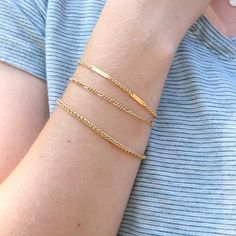 Simple ready to wear modern layering bracelets in 14k Gold filled. ✦ Quantity: 1 chain ✦ Material: 14K Gold filled ✦ Dimensions: 6.5 inches with 1 inch extender Wheat Chain Width: 2.9mm Figaro Chain Width: 2.2mm Flat Chain Width: 2.3mm ✦ Surface: shiny gold Ships next business day. ✦✦ SAVE 15% over $75+ CODE: SAVE15✦✦ Please let us know if you are interested in a higher quantity than what is currently listed. *International customers will be responsible for Import duties, taxes, since these are Modern Bracelets With Rectangular Figaro Chain Links, Modern Everyday Figaro Chain Bracelet, Everyday Figaro Chain Bracelet, Dainty Bracelet With Figaro Chain Link, Dainty Bracelet With Figaro Chain, Dainty Figaro Chain Link Bracelet, Minimalist Figaro Chain Bracelet, Minimalist Adjustable Figaro Chain Bracelet, Minimalist Hypoallergenic Chain Link Bracelet