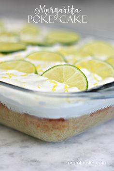 a close up of a cake in a pan with limes