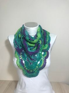 This is a scarf in green,purple and turquoise. Its size is 100x50 cm and 39.5 x 19,7 inches. Green Purple Crochet Scarf/Gifts for her/Scarf for women handmade/Crochet gifts/Crochet scarf handmade/Cheap gifts for friends/Scarf for her Delivery times: North America: 3-5 weeks United Kingdom and EU: 2-4 weeks Asia: 3-5 weeks South America: 4-5 weeks South Africa: 4-5 weeks Australia 3-6 weeks Care Instructions: Hand wash or machine wash in gentle cycle with cold water.Flat air drying is preferred.I Handmade Green Bohemian Shawl, Green One Size Scarf As A Gift, Green One-size Scarf As Gift, Green Bohemian Crochet Shawl, Bohemian Green Crochet Shawl, Green Handmade Shawl As Gift, Handmade Green Shawl For Gift, One Size Green Crochet Shawl, Purple Crochet Yarn Scarves