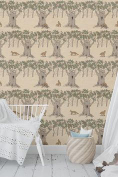 a baby's room with a white crib and wallpaper