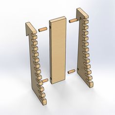 two wooden pegs are standing next to each other