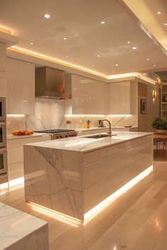 a large kitchen with marble counter tops and white cabinets, along with an island in the middle