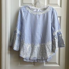 This Cute White With Light Blue Stripe Blouse Is Lace Trim With Self Tie Bow In The Back. It Has Adorable Bell Sleeves. Never Worn. Comes From A Smoke And Pet Free Home. Silk Backless Top, Floral Work Blouse, Lace Vest Top, Blue Striped Blouse, Striped Peplum Top, Stripe Blouse, Black Button Down Shirt, Lace Vest, Tie Bow