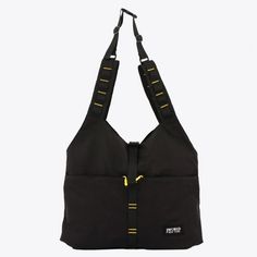 a black bag with yellow zippers hanging from it's shoulder and two handles