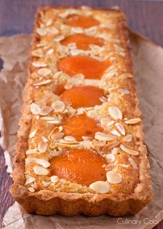 a piece of bread topped with fruit and almonds